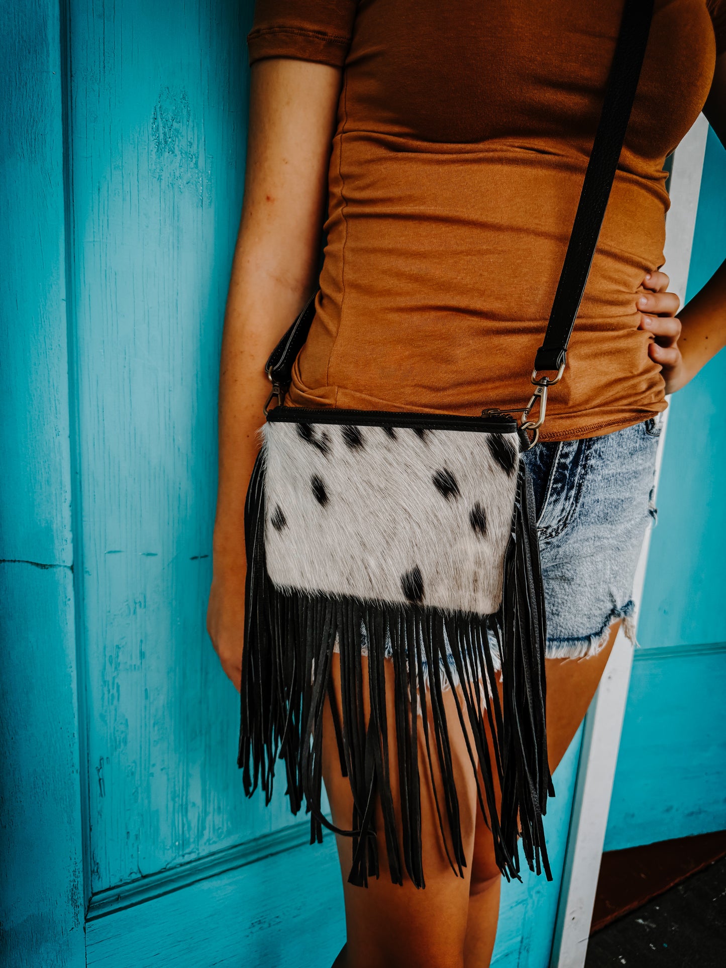 Cowhide with fringe purse