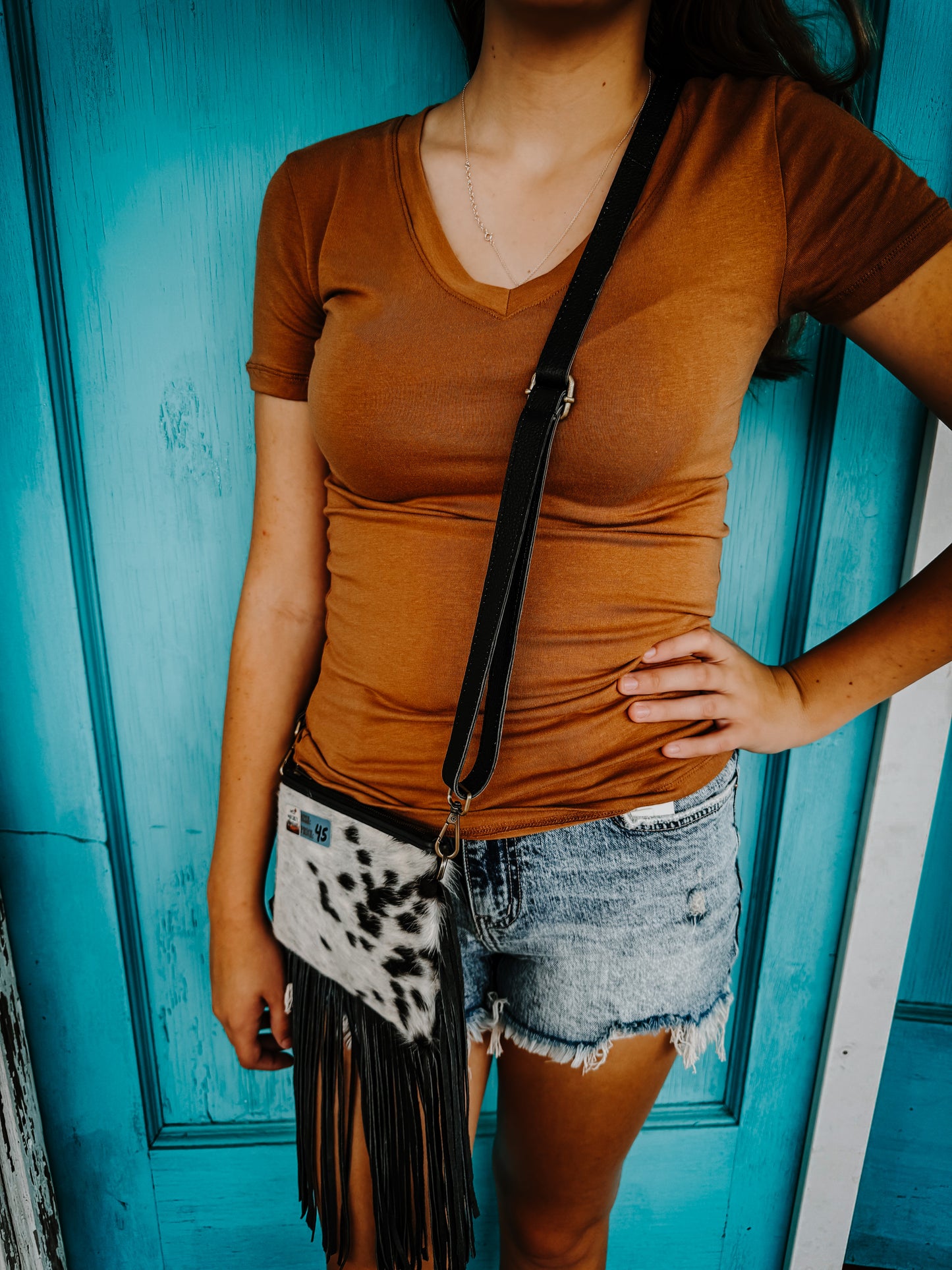 Cowhide with fringe purse